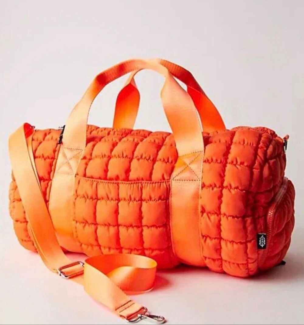 Free People Quilted Duffle Bag in Tangerine
